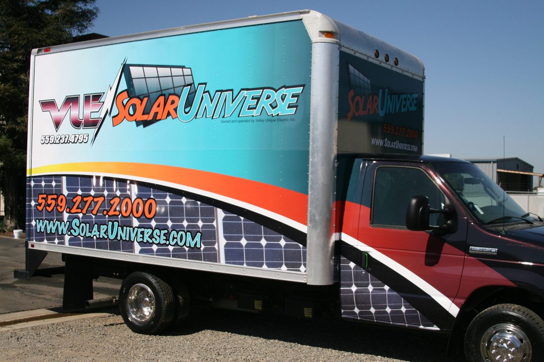 Work truck with a full-color vehicle wrap for a Fresno business